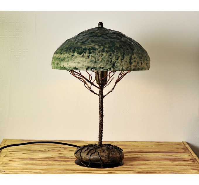 Metal table lamp with a ceramic shade and stone stand