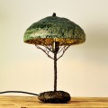 Metal table lamp with a ceramic shade and stone stand