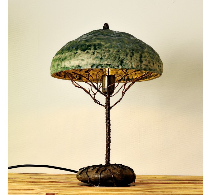 Metal table lamp with a ceramic shade and stone stand