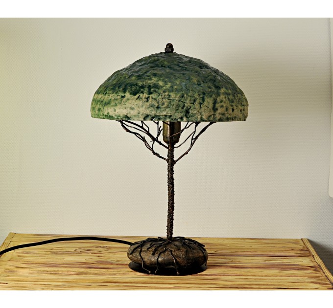 Metal table lamp with a ceramic shade and stone stand