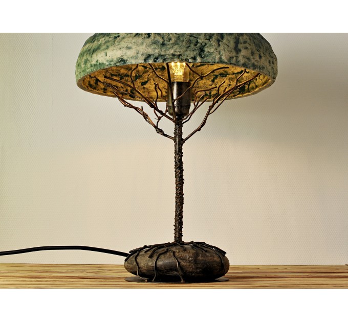 Metal table lamp with a ceramic shade and stone stand