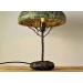 Metal table lamp with a ceramic shade and stone stand