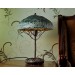 Metal table lamp with a ceramic shade and stone stand
