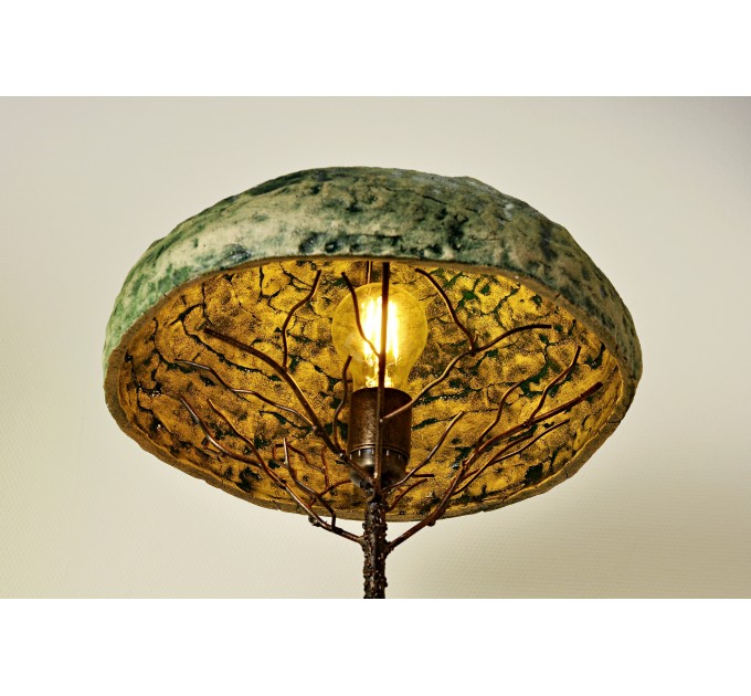 Metal table lamp with a ceramic shade and stone stand