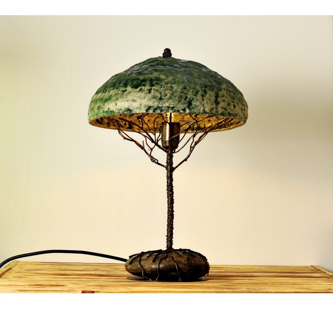 Metal table lamp with a ceramic shade and stone stand