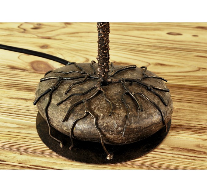 Metal table lamp with a ceramic shade and stone stand