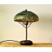 Metal table lamp with a ceramic shade and stone stand