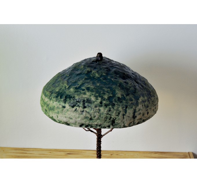 Metal table lamp with a ceramic shade and stone stand