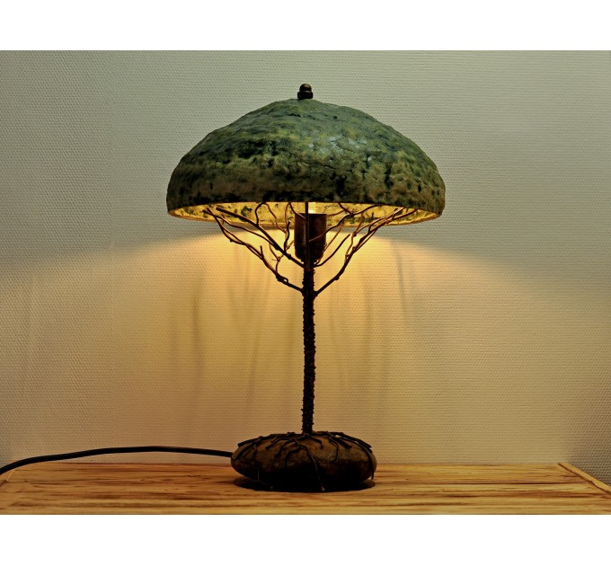 Metal table lamp with a ceramic shade and stone stand
