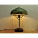 Metal table lamp with a ceramic shade and stone stand