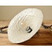 Handmade ceramic lamp in a rustic style hanging on a metal chain 