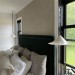 Handmade ceramic lamp in a rustic style hanging on a metal chain 