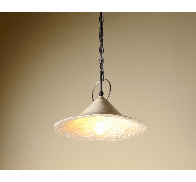 Handmade ceramic lamp in a rustic style hanging on a metal chain 